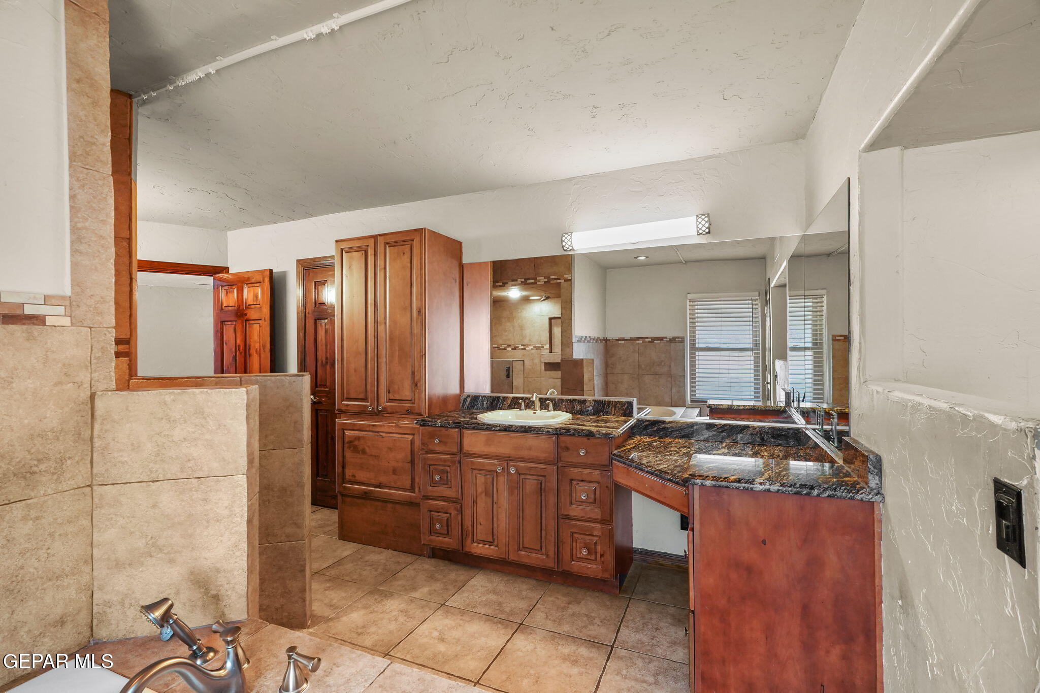 5300 Crawford Road Santa Teresa, NM 88008 - Photo 37 of 87 a kitchen with stainless steel appliances granite countertop a stove a sink and a refrigerator