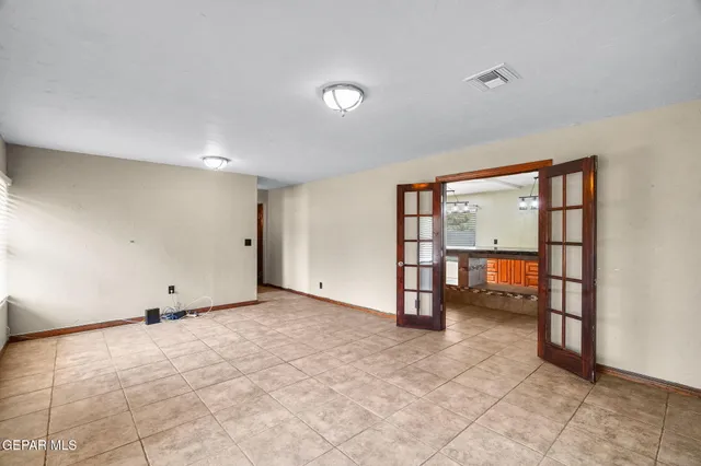 a big room with closet and windows