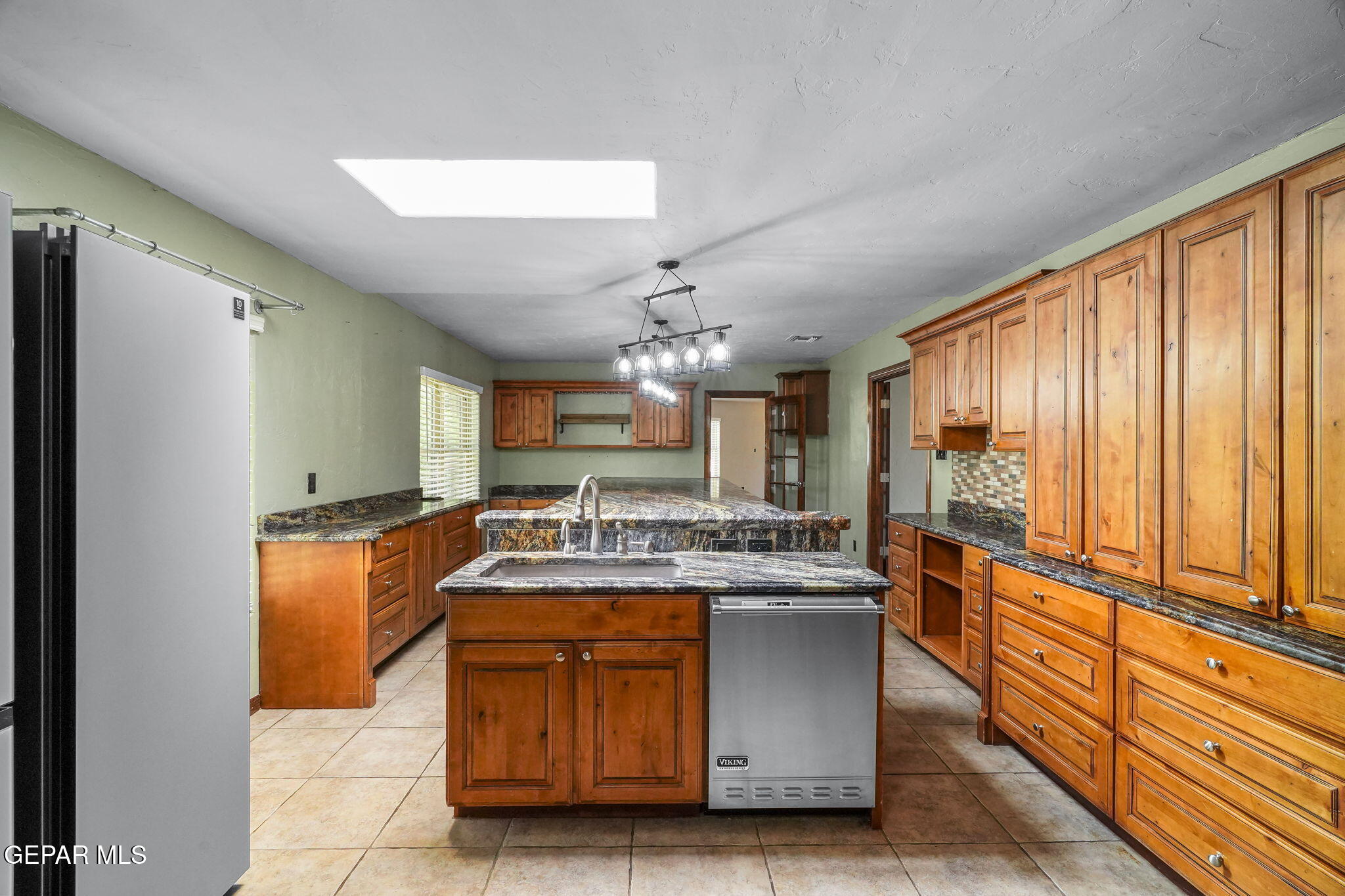5300 Crawford Road Santa Teresa, NM 88008 - Photo 47 of 87 a bathroom with a granite countertop sink and a mirror