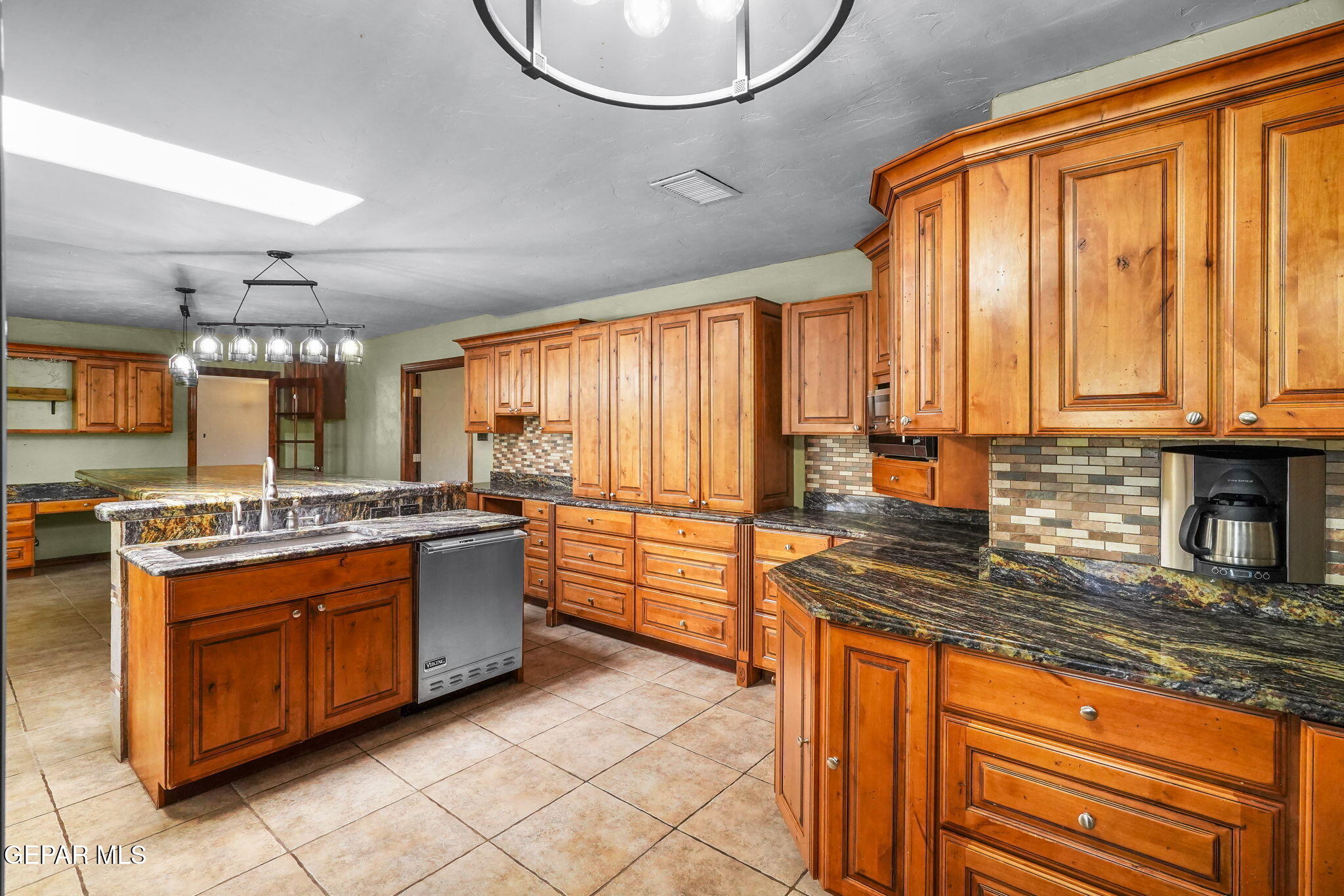 5300 Crawford Road Santa Teresa, NM 88008 - Photo 49 of 87 a kitchen with stainless steel appliances granite countertop a stove a sink and a refrigerator