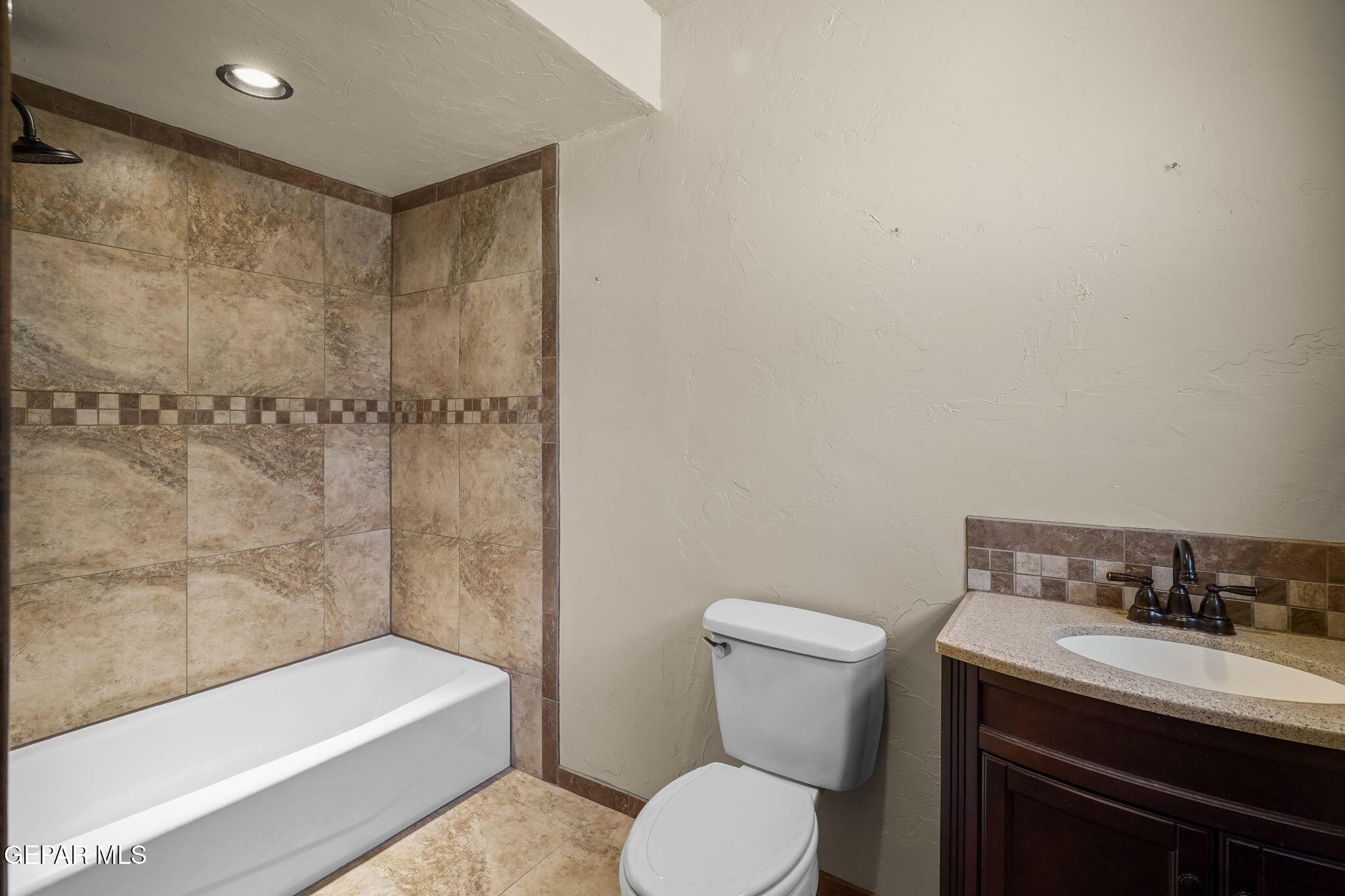 5300 Crawford Road Santa Teresa, NM 88008 - Photo 72 of 87 a bathroom with a granite countertop sink toilet and shower