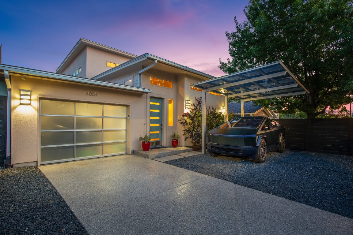 3005 East Martin Luther King Jr Boulevard Austin, TX 78702 - Photo 1 of 39 a view of a house with a barbeque and wooden fence