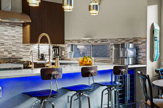a kitchen with stainless steel appliances granite countertop a stove and a sink