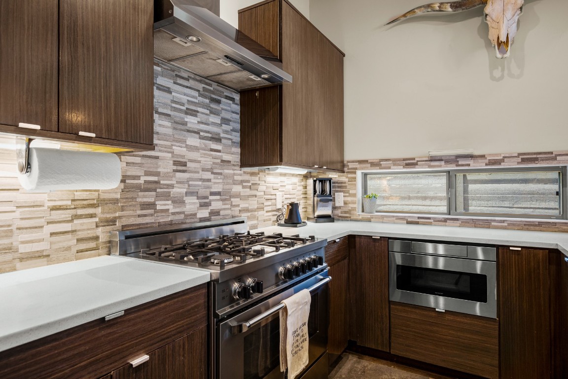 3005 East Martin Luther King Jr Boulevard Austin, TX 78702 - Photo 13 of 39 a kitchen with a stove and a sink