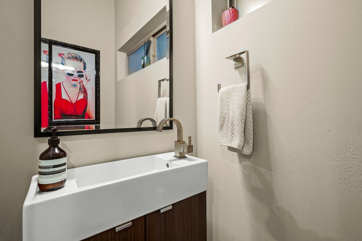 3005 East Martin Luther King Jr Boulevard Austin, TX 78702 - Photo 17 of 39 a bathroom with a sink and a mirror