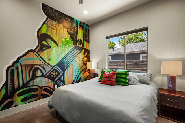 a bathroom with a granite countertop sink toilet and a mirror