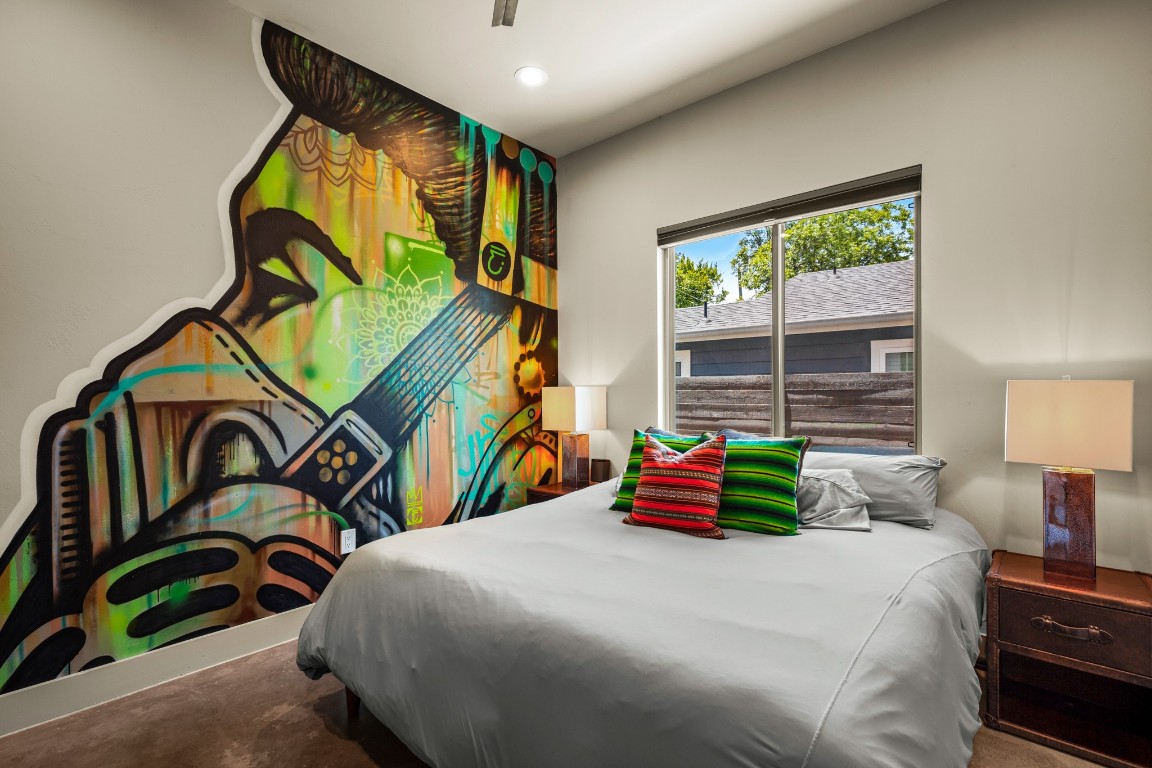 3005 East Martin Luther King Jr Boulevard Austin, TX 78702 - Photo 19 of 39 a bedroom with a bed and a painting on the wall