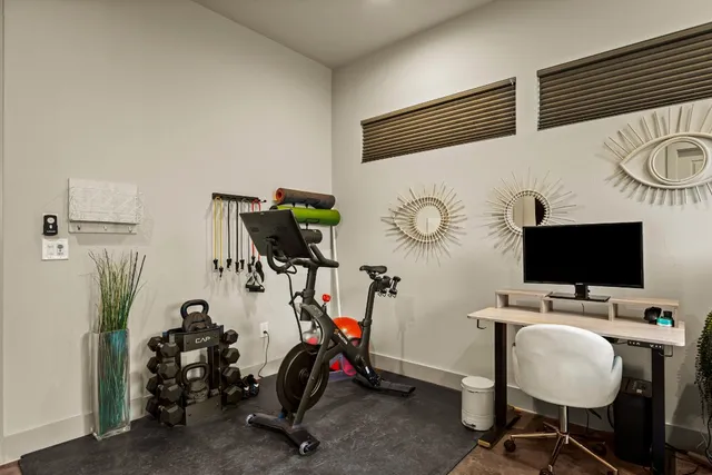 wooden floor with table and chairs