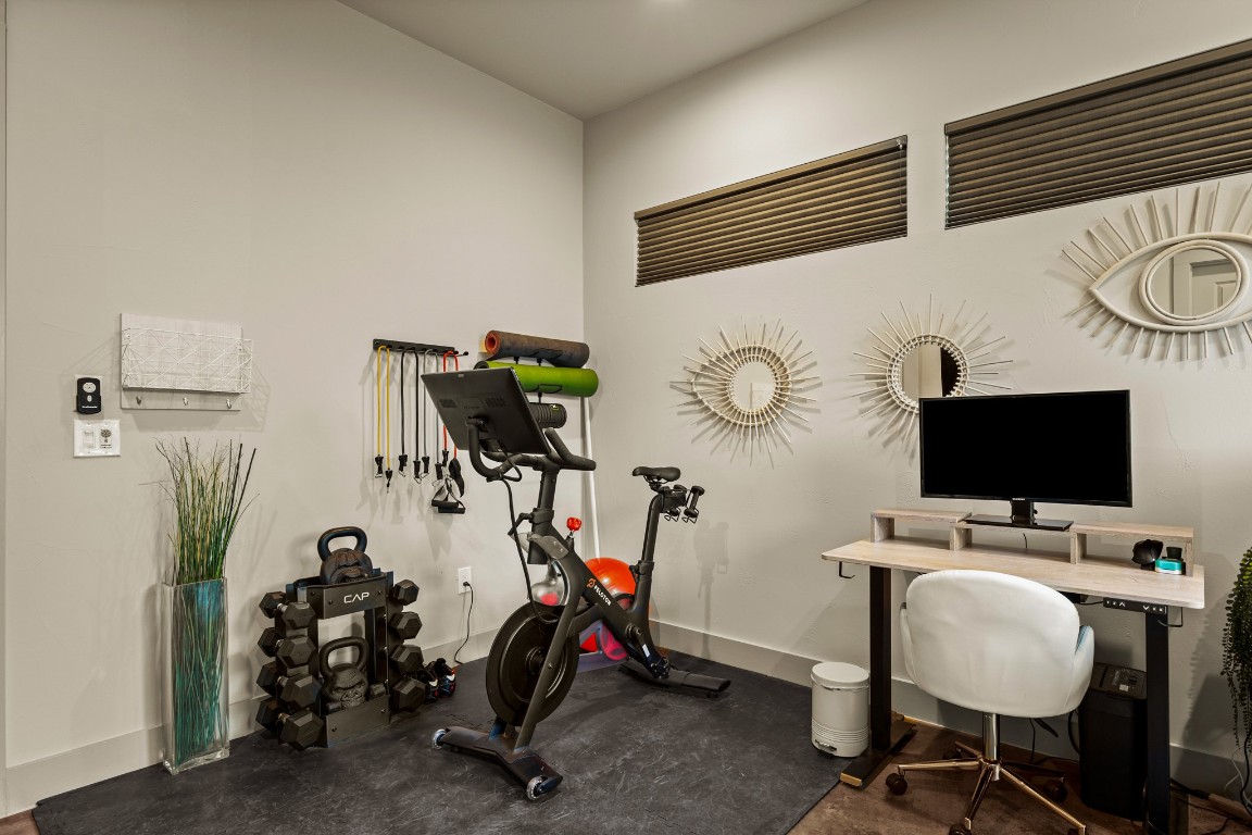 3005 East Martin Luther King Jr Boulevard Austin, TX 78702 - Photo 23 of 39 a view of a workspace with furniture and a mirror