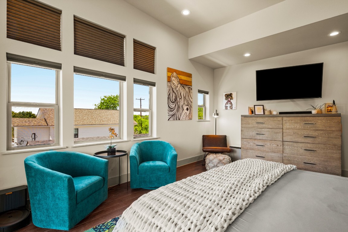 3005 East Martin Luther King Jr Boulevard Austin, TX 78702 - Photo 30 of 39 a bedroom with furniture and a flat screen tv