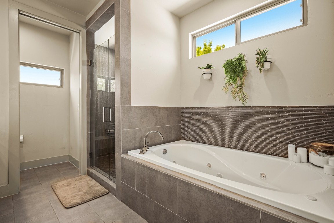 3005 East Martin Luther King Jr Boulevard Austin, TX 78702 - Photo 33 of 39 a bathroom with a bathtub and shower