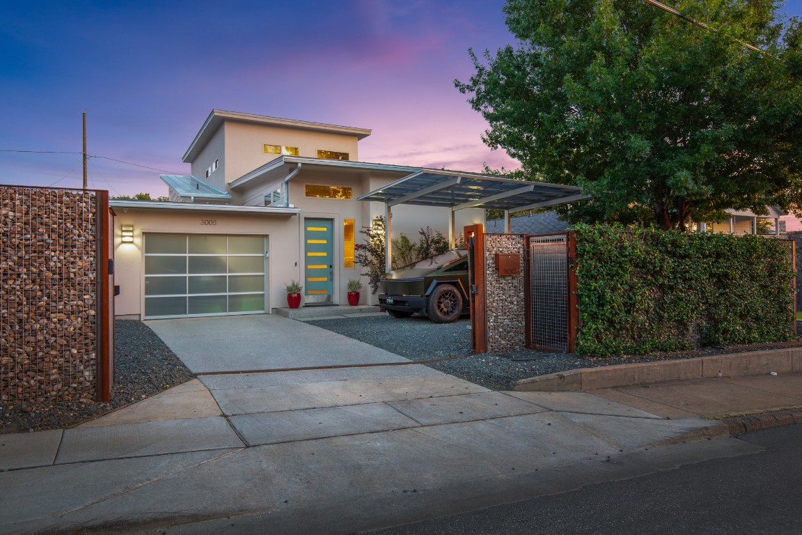 3005 East Martin Luther King Jr Boulevard Austin, TX 78702 - Photo 38 of 39 a front view of a house with a yard and garage