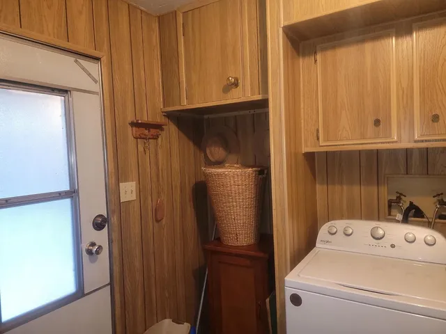 a view of storage and utility room with washer and dryer