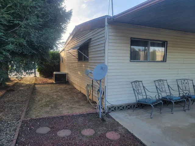 a view of a patio with a table and chairs