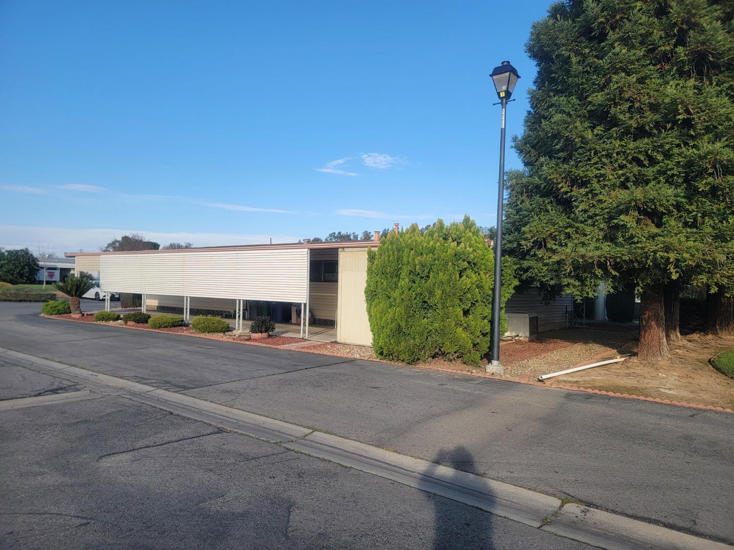 1300 West Olson Avenue, Unit 52 Reedley, CA 93654 - Photo 23 of 26 a view of parking area