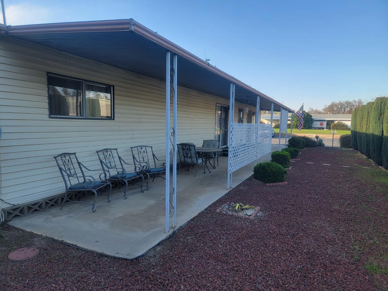 1300 West Olson Avenue, Unit 52 Reedley, CA 93654 - Photo 24 of 26 a view of a house with backyard and porch