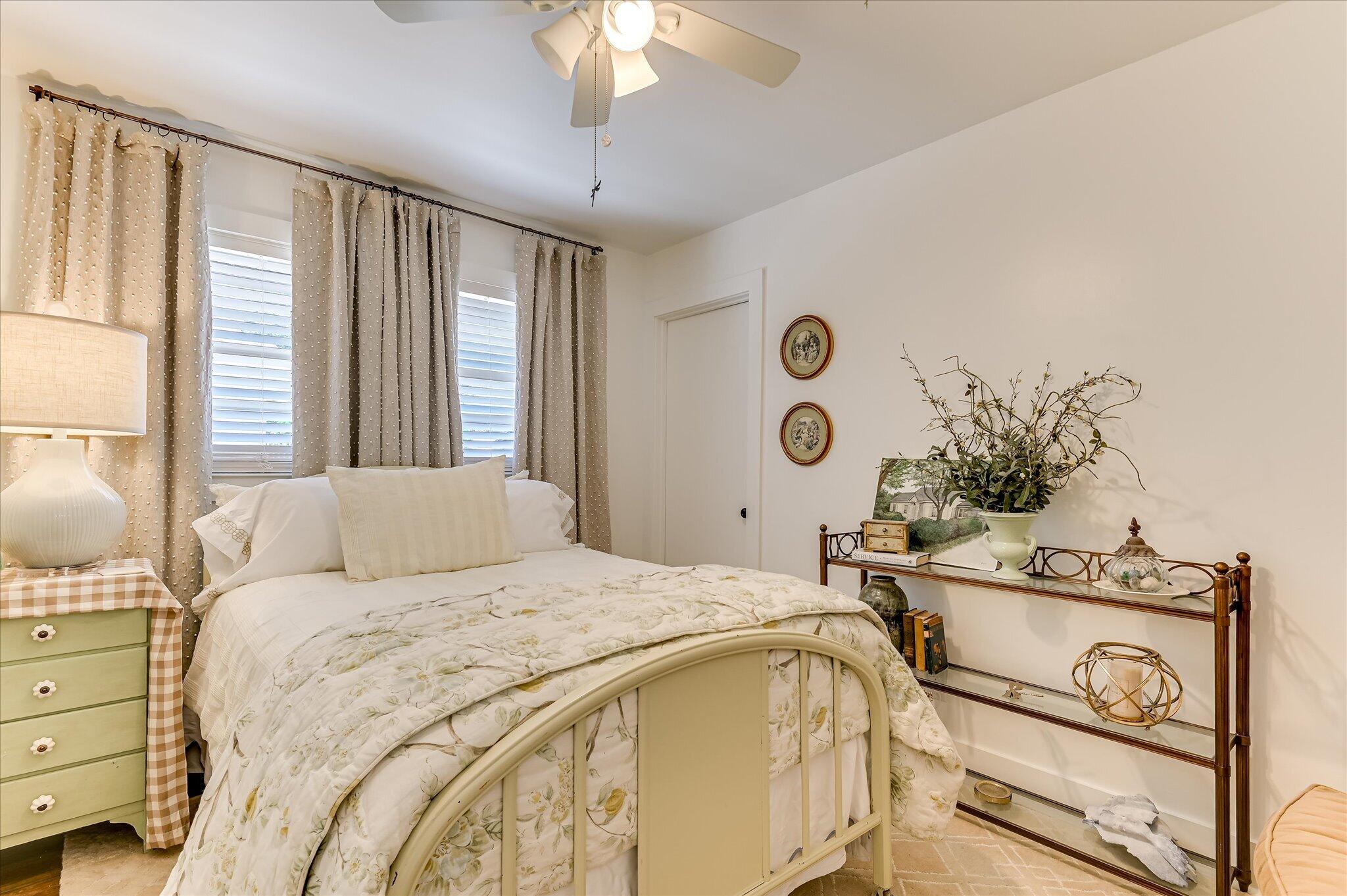 1121 Ridgecrest Avenue North Augusta, SC 29841 - Photo 22 of 42 a bedroom with a bed and a chandelier