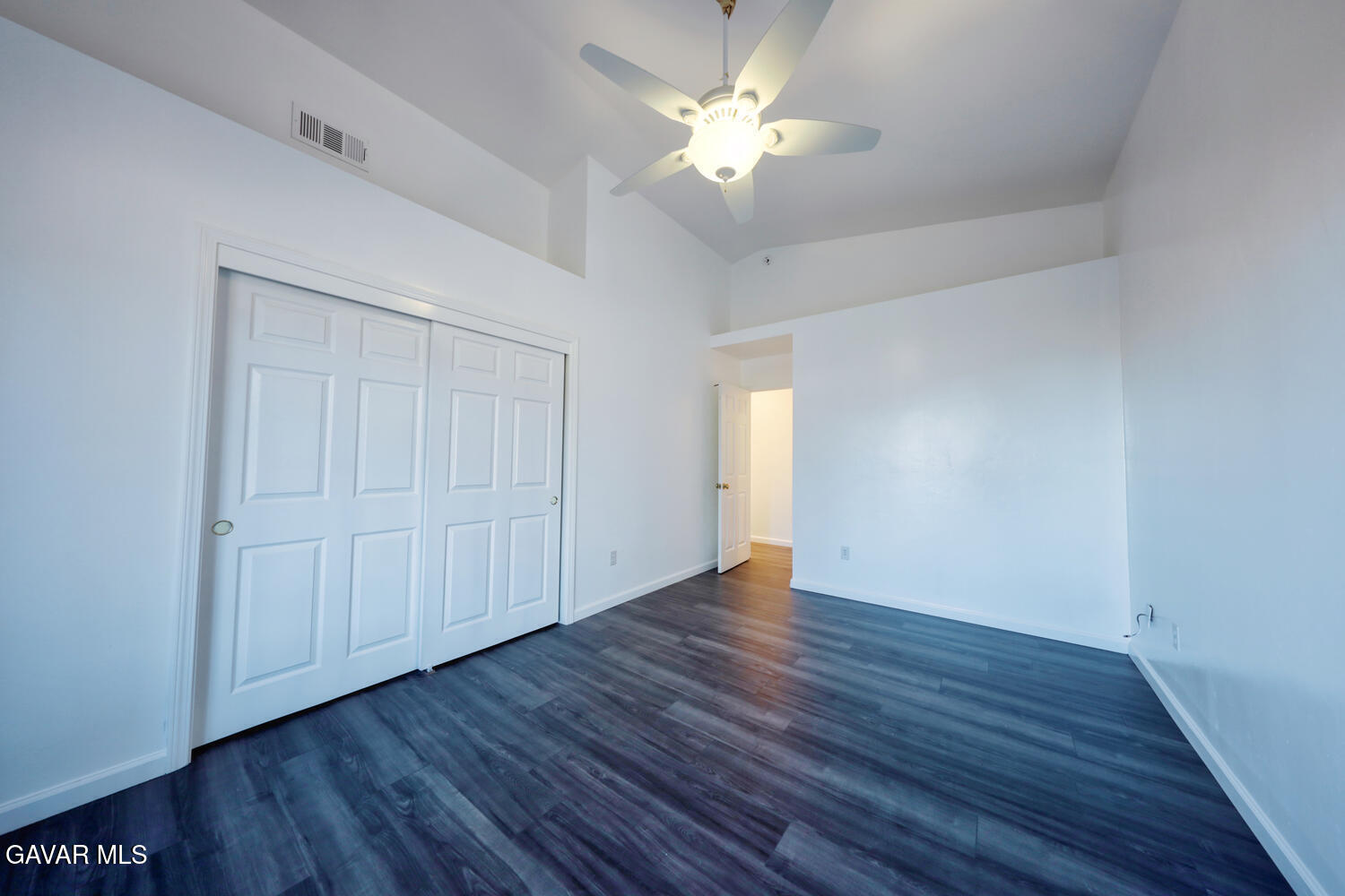 26801 Cabriolet Court Tehachapi, CA 93561 - Photo 33 of 60 a view of an empty room with a window and wooden floor