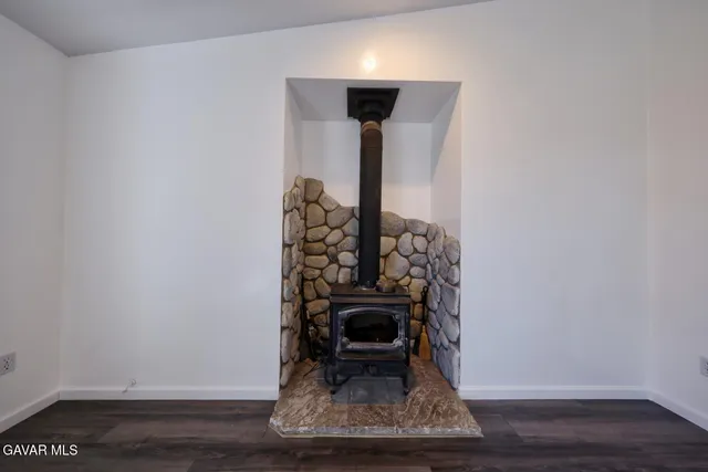 a bedroom with bed and window