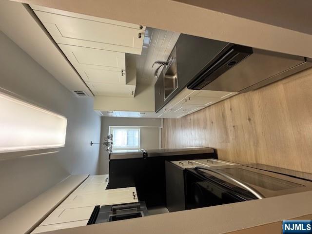360 Knickerbocker Road, Unit 28 Dumont, NJ 07628 - Photo 2 of 11 a kitchen with granite countertop a refrigerator stove and sink