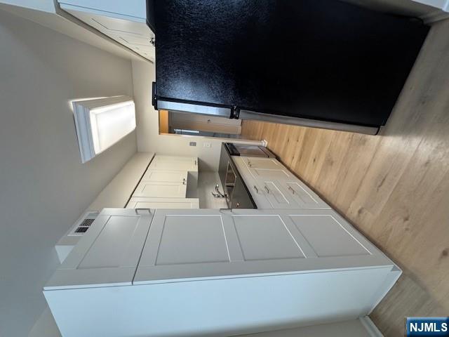 360 Knickerbocker Road, Unit 28 Dumont, NJ 07628 - Photo 3 of 11 a kitchen with a refrigerator and a stove top oven
