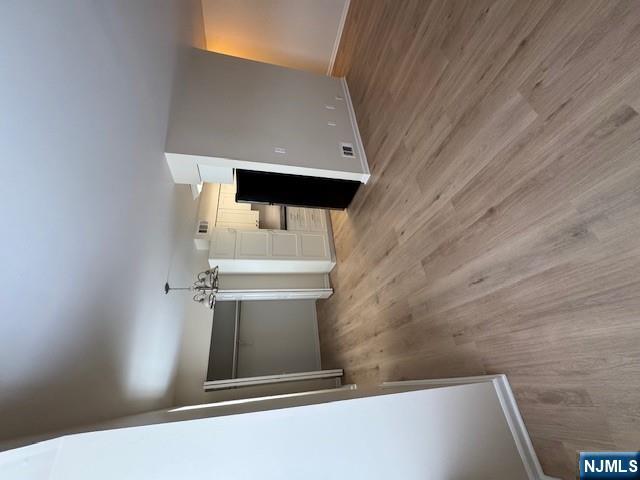 360 Knickerbocker Road, Unit 28 Dumont, NJ 07628 - Photo 5 of 11 a view of a room with wooden floor and staircase
