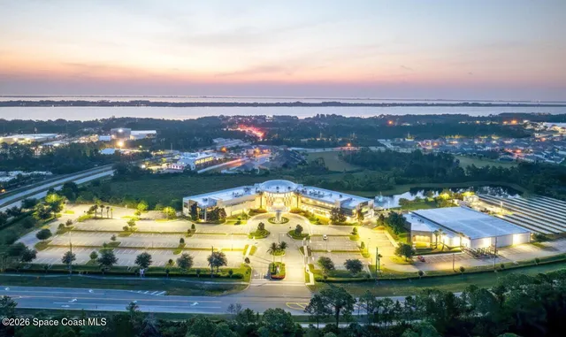 an aerial view of a residential houses with outdoor space