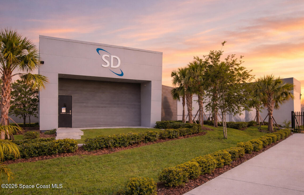 8615-8635 Holiday Springs Road Rockledge, FL 32955 - Photo 4 of 17 a view of a house with a yard