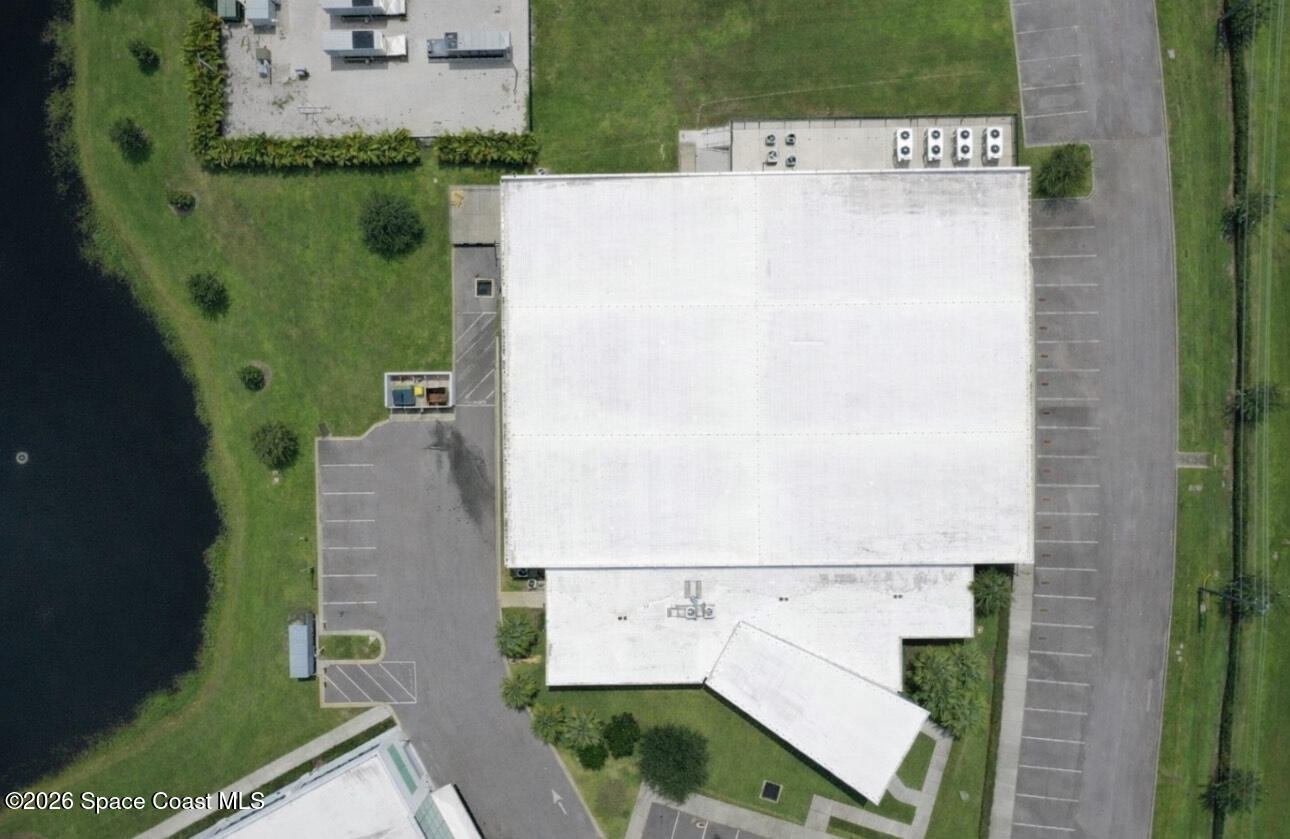 8615-8635 Holiday Springs Road Rockledge, FL 32955 - Photo 5 of 17 an aerial view of a house with a yard