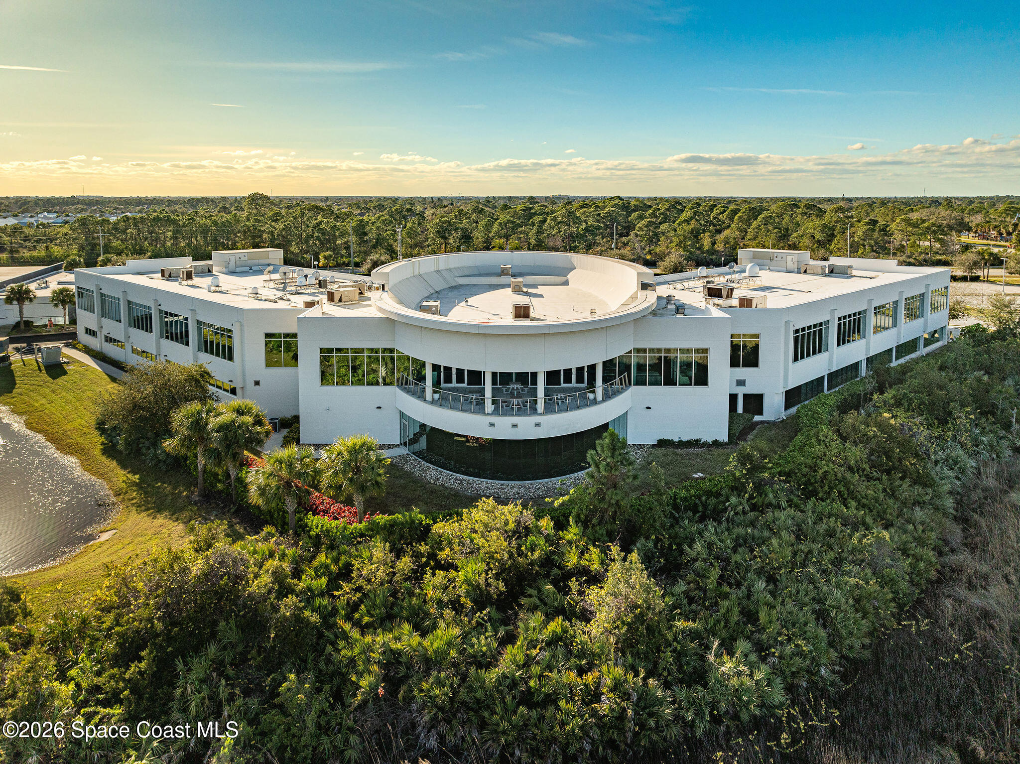 8615-8635 Holiday Springs Road Rockledge, FL 32955 - Photo 5 of 13 a view of a white building with a ocean view