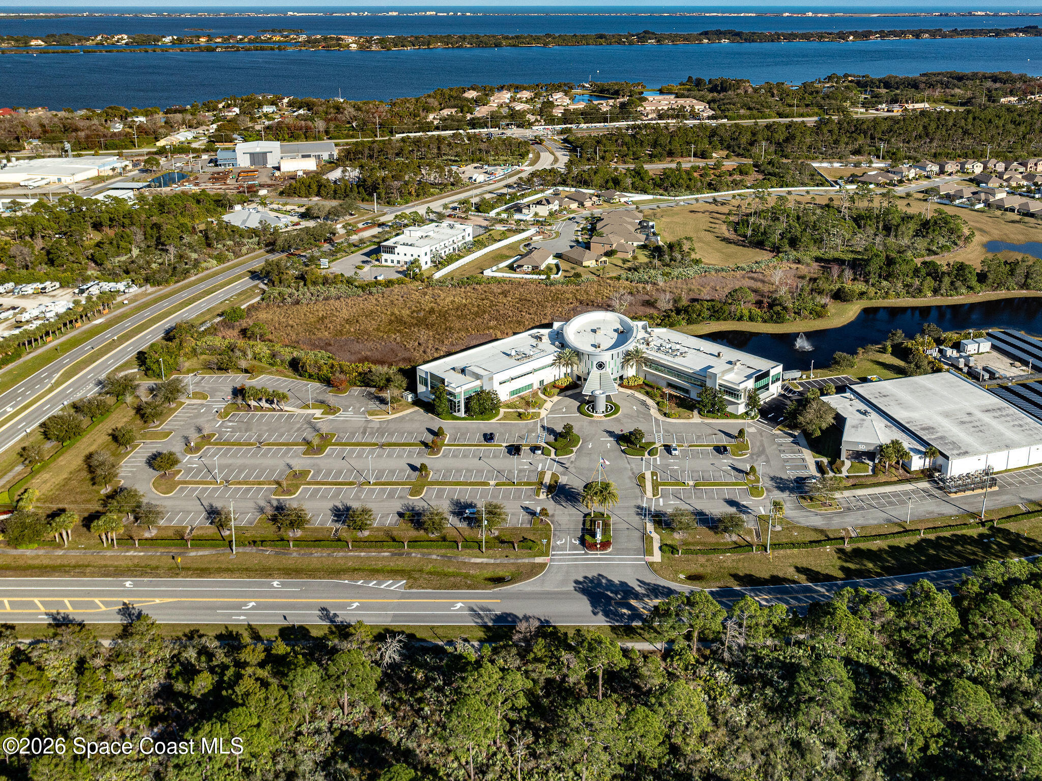 8615-8635 Holiday Springs Road Rockledge, FL 32955 - Photo 9 of 13 a view of building with ocean view