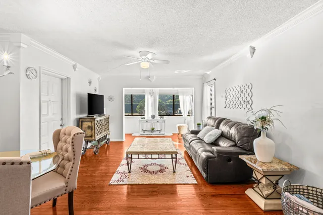 a living room with furniture fireplace and a flat screen tv