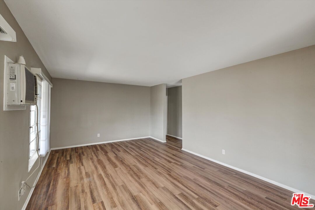 17377 Fairview Road Fontana, CA 92336 - Photo 13 of 39 a view of room with window and wooden floor
