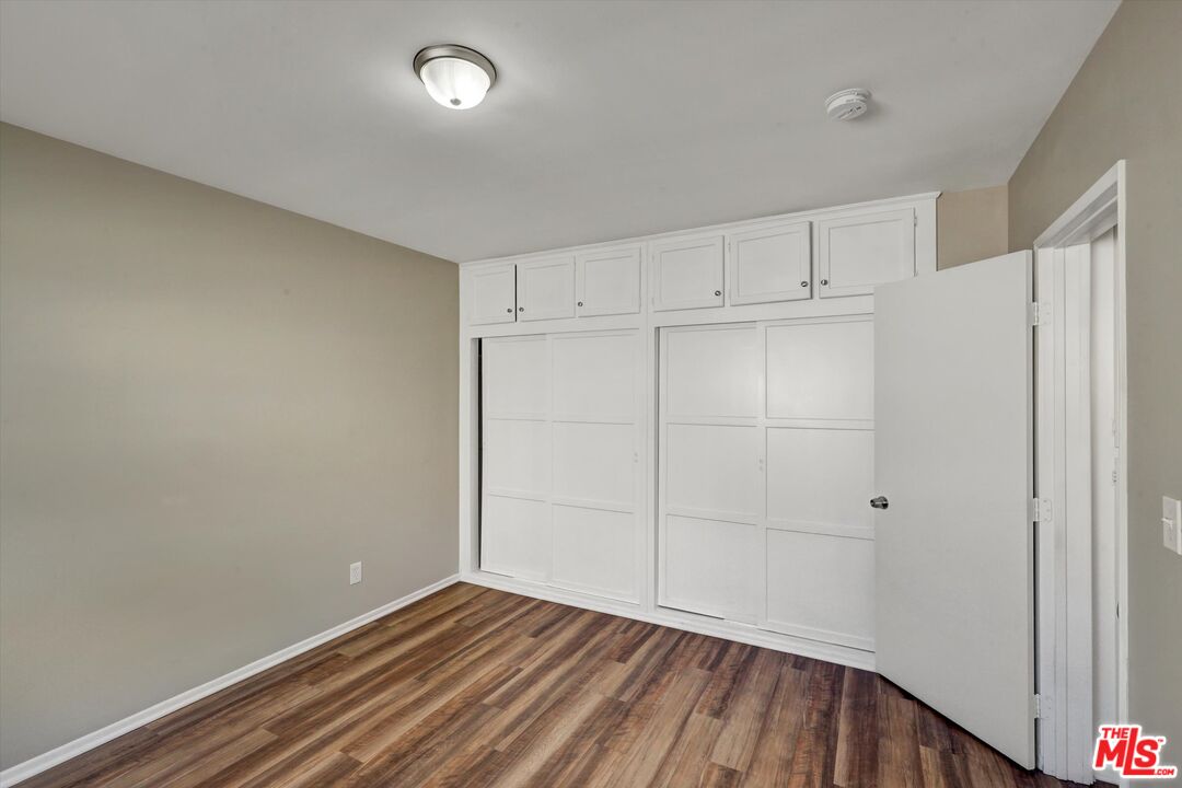 17377 Fairview Road Fontana, CA 92336 - Photo 28 of 39 a view of an empty room with wooden floor
