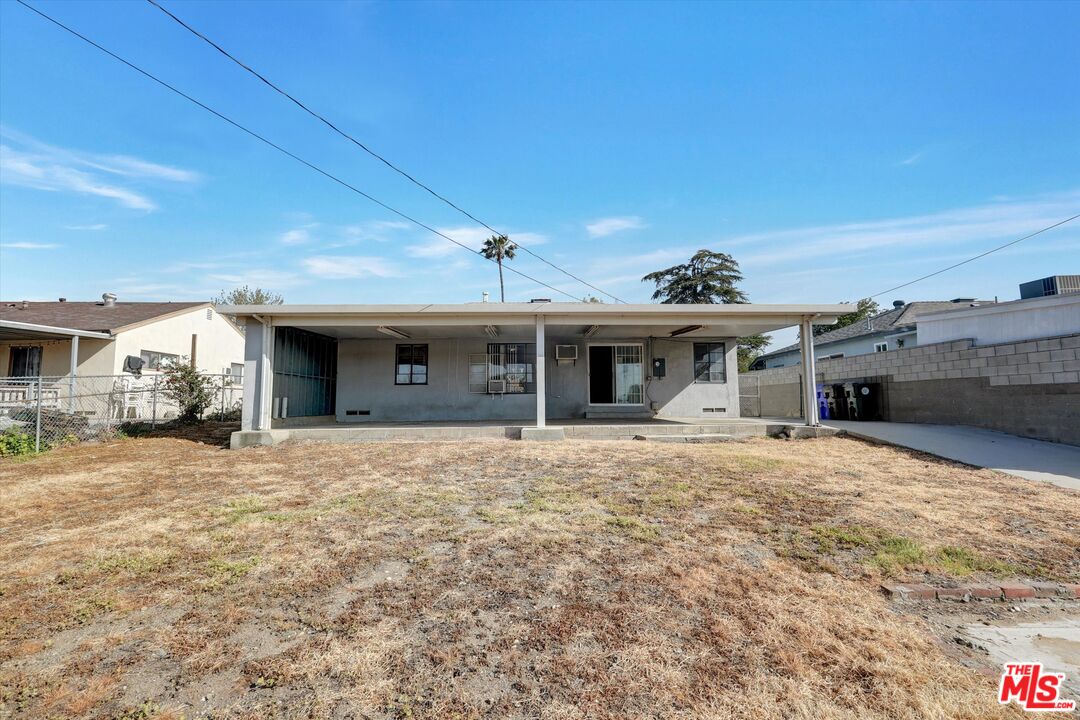 17377 Fairview Road Fontana, CA 92336 - Photo 37 of 39 a front view of a house with a yard and garage