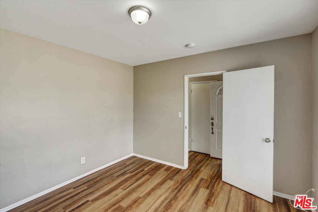 17377 Fairview Road Fontana, CA 92336 - Photo 6 of 39 a view of a room with wooden floor and closet