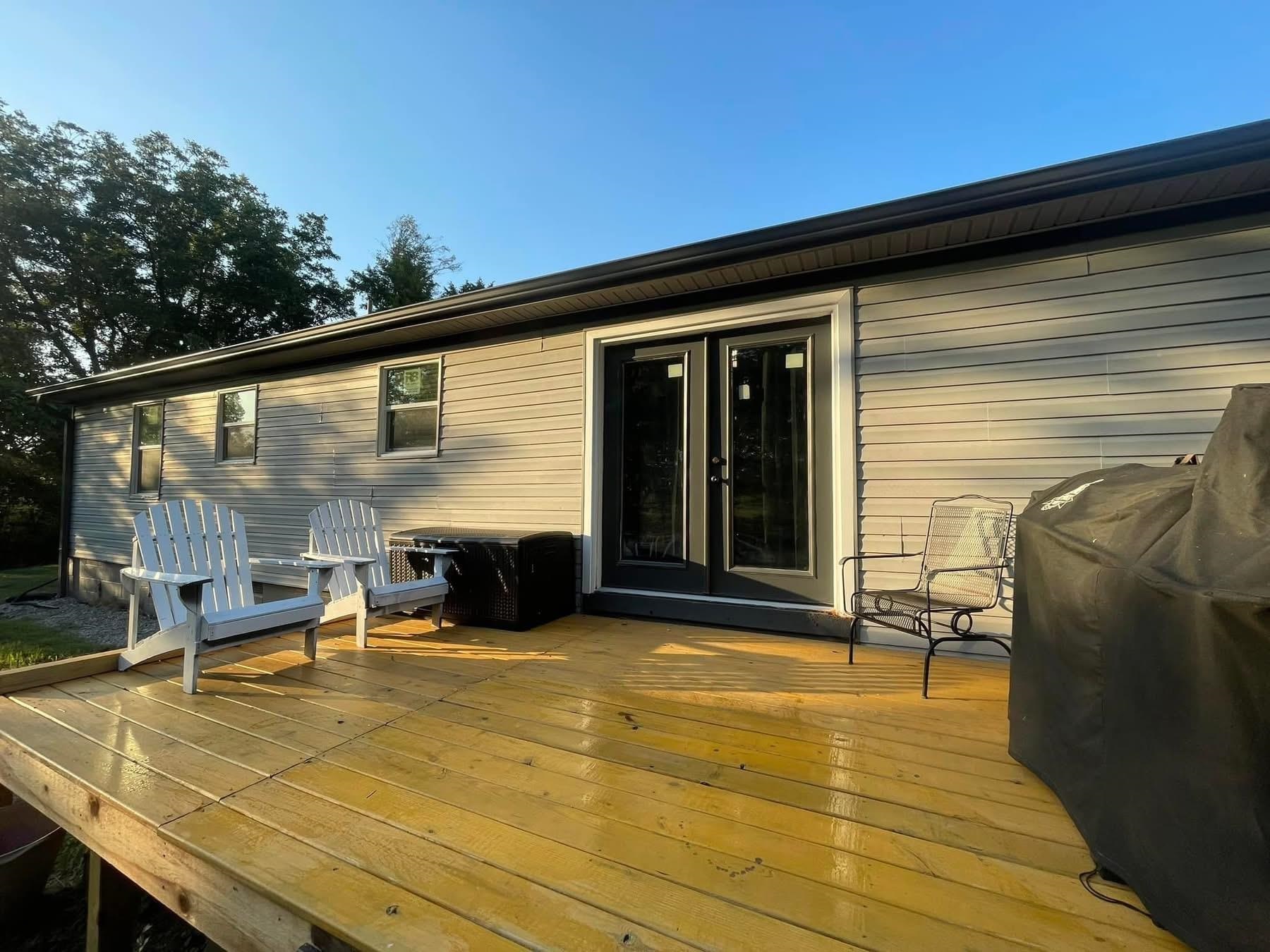 2003 Bond Ferry Road Brownsville, TN 38012 - Photo 13 of 21 Wooden deck with area for grilling and french doors