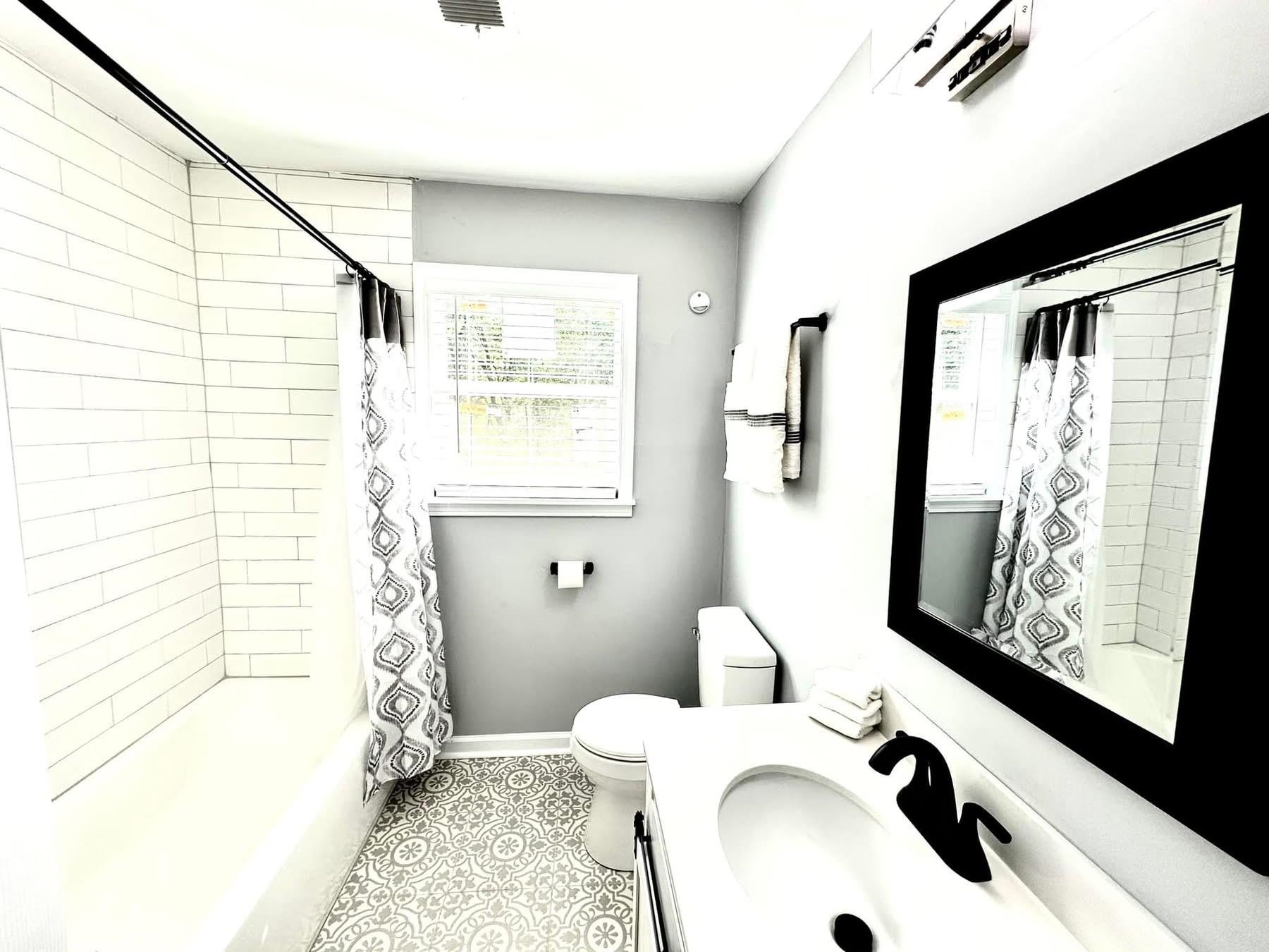 2003 Bond Ferry Road Brownsville, TN 38012 - Photo 16 of 21 Bathroom with shower / tub combo, vanity, and light tile patterned flooring