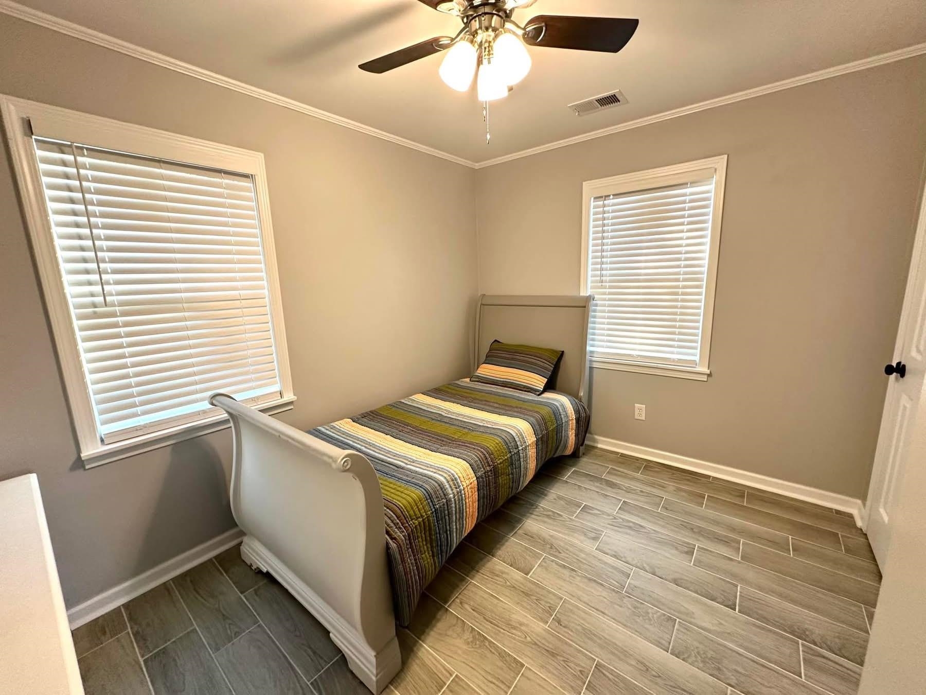 2003 Bond Ferry Road Brownsville, TN 38012 - Photo 18 of 21 Bedroom featuring wood finish floors, ceiling fan, and ornamental molding