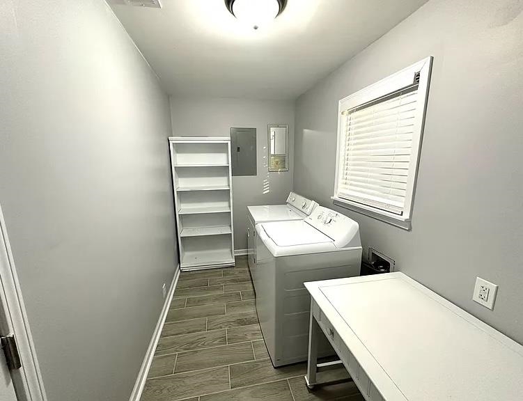 2003 Bond Ferry Road Brownsville, TN 38012 - Photo 19 of 21 Laundry room with wood finish floors, separate washer and dryer, and electric panel