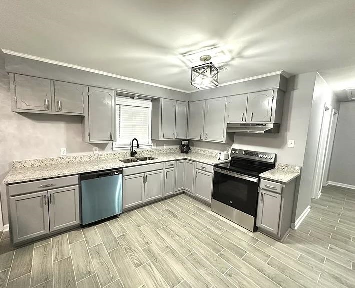 2003 Bond Ferry Road Brownsville, TN 38012 - Photo 2 of 21 Kitchen featuring gray cabinets, stainless steel appliances, and wood finish floors