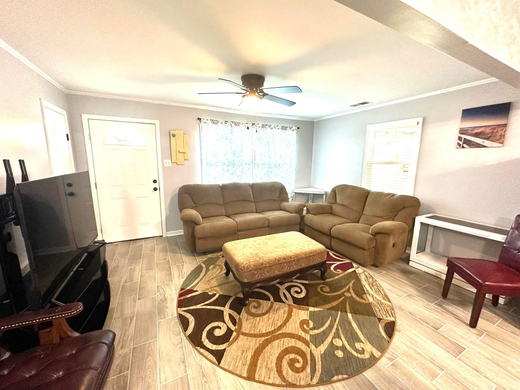 2003 Bond Ferry Road Brownsville, TN 38012 - Photo 6 of 21 Living area featuring wood finish floors, ornamental molding, and ceiling fan