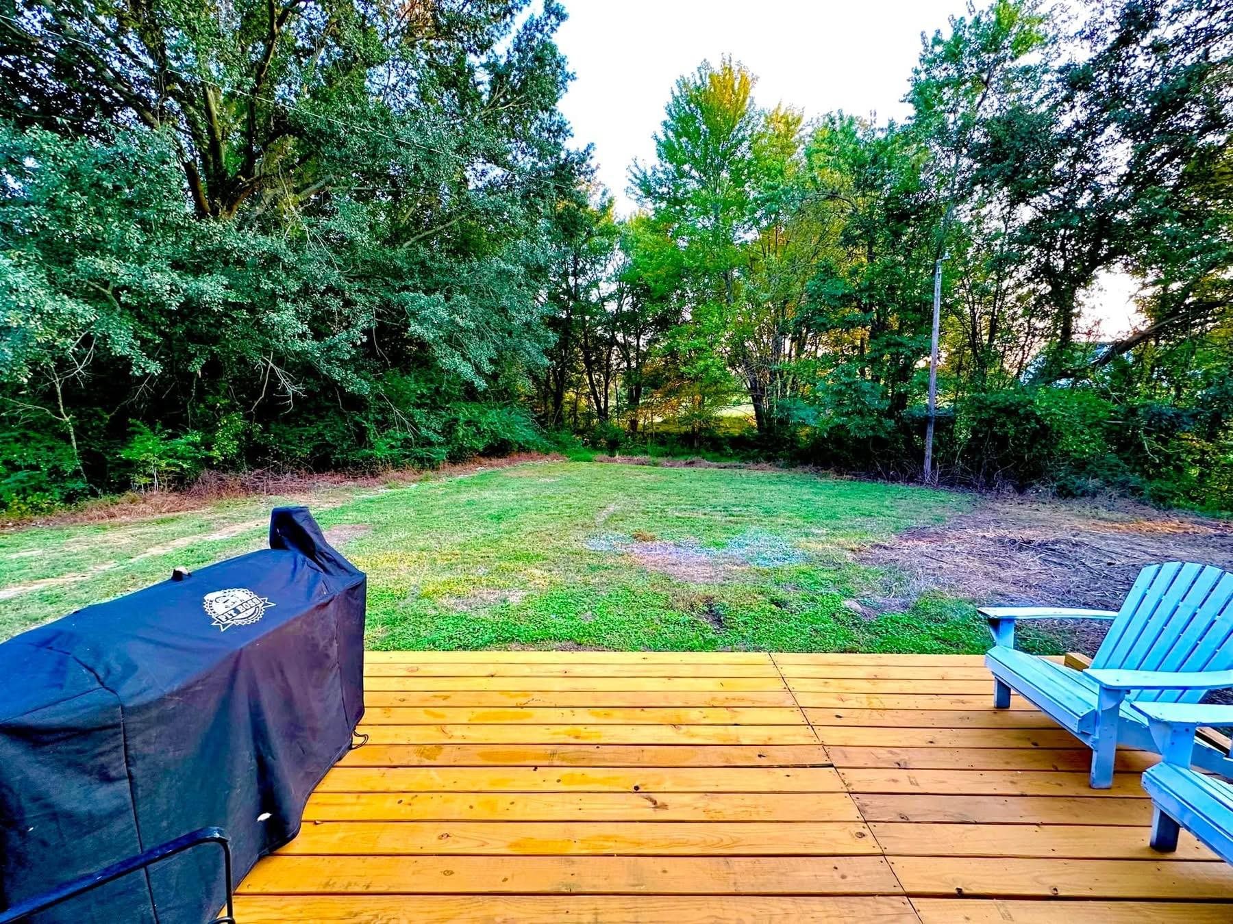 2003 Bond Ferry Road Brownsville, TN 38012 - Photo 10 of 21 Deck with a grill and a yard