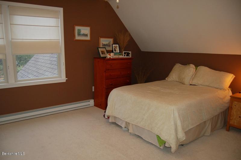 204 Bunce Road South Sheffield, MA 01222 - Photo 15 of 26 a bed sitting in a bedroom next to a window