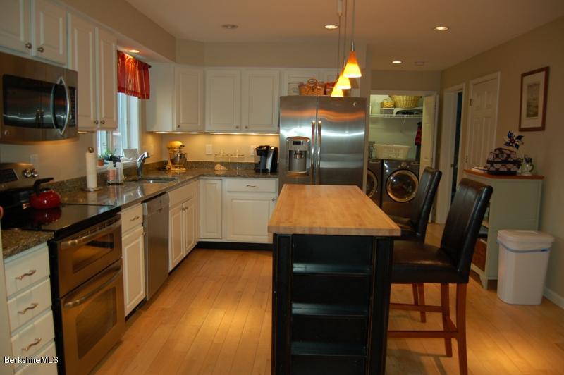 204 Bunce Road South Sheffield, MA 01222 - Photo 3 of 26 a kitchen with stainless steel appliances granite countertop a sink a stove and a refrigerator