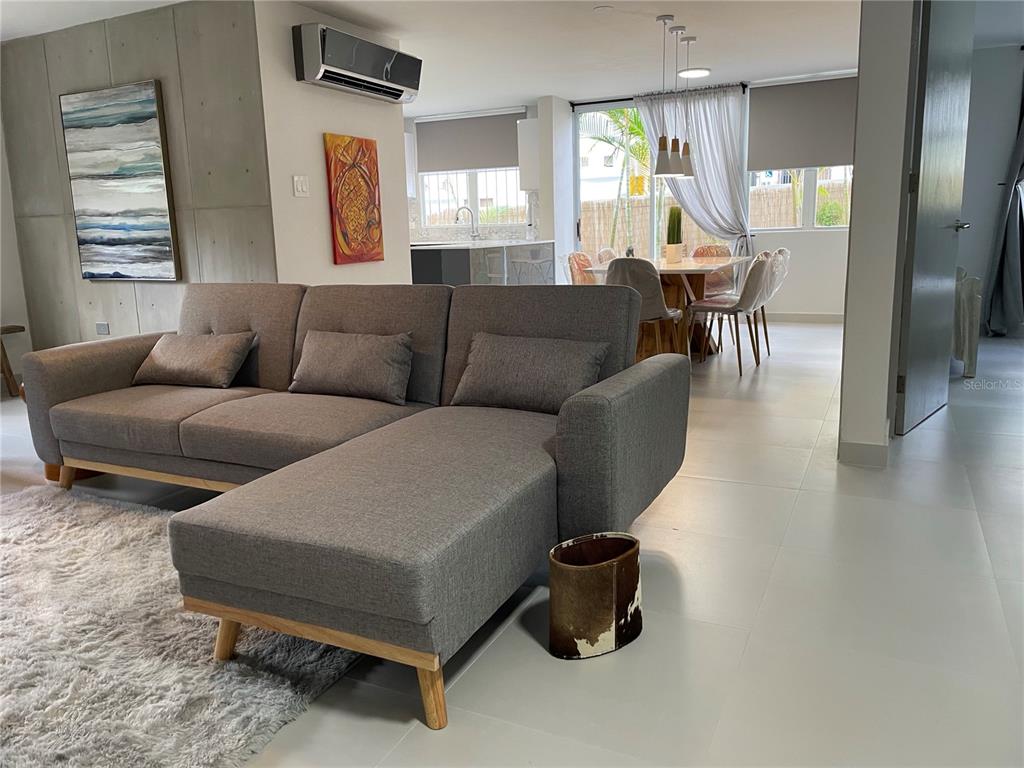 290 Av. Sta. Ana Guaynabo, Bayamón 00969 - Photo 3 of 23 a living room with furniture and wooden floor