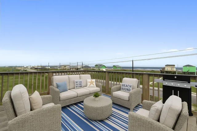 a balcony with furniture and city view