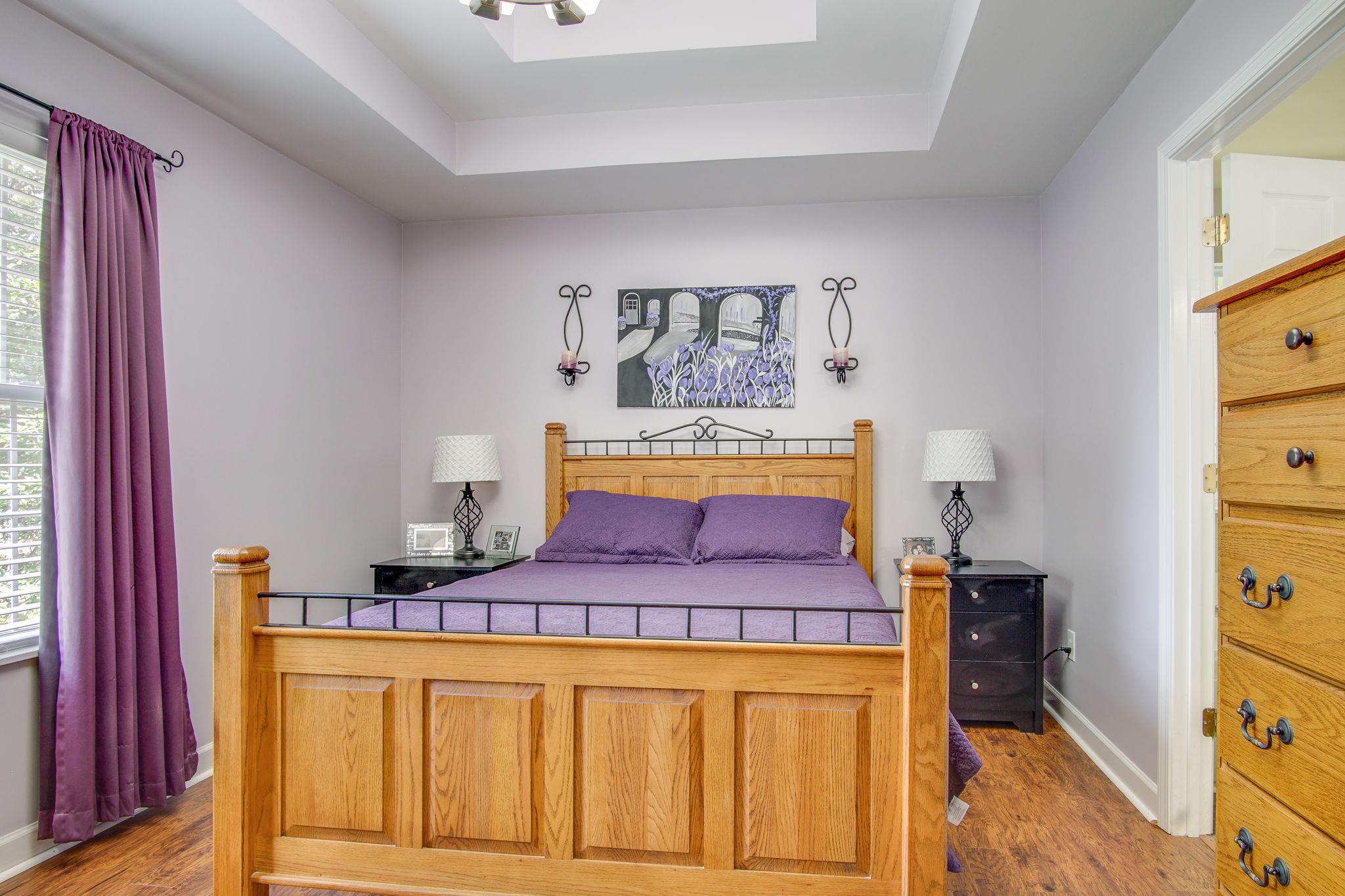 1674 Eno Road Dickson, TN 37055 - Photo 14 of 28 a bedroom with a bed and wooden floor