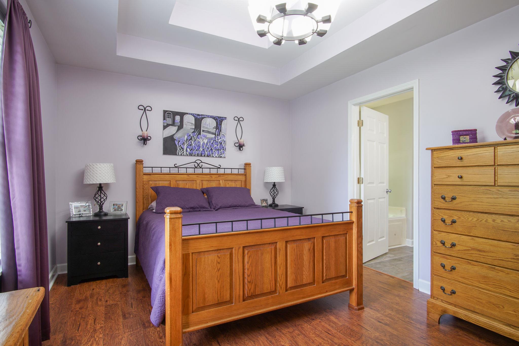 1674 Eno Road Dickson, TN 37055 - Photo 15 of 28 a bedroom with a bed and a dresser in it