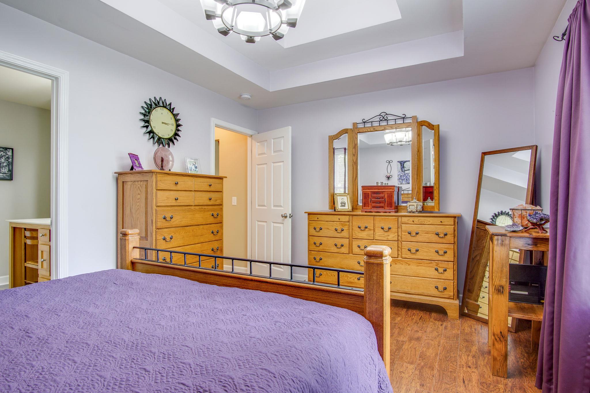 1674 Eno Road Dickson, TN 37055 - Photo 17 of 28 a bedroom with a bed and a dresser in it